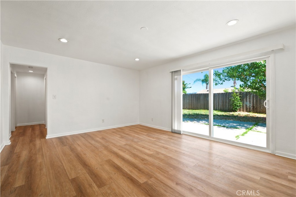 1720 Anderson Street Simi Valley, CA 93065 - Photo 12 of 30 a view of an empty room with wooden floor and a window