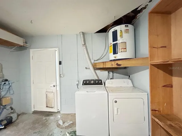 a utility room with dryer and washer