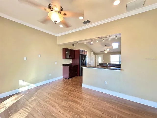 a view of a kitchen with a dishwasher cabinets and wooden floor