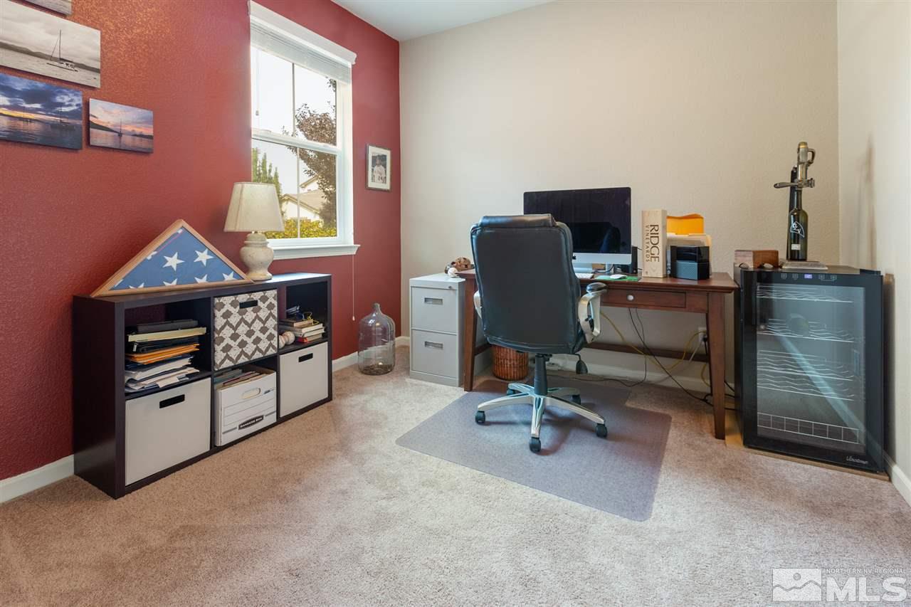 10800 Pebble Hill Drive Reno, NV 89521 - Photo 14 of 21 a view of a workspace with furniture and a window