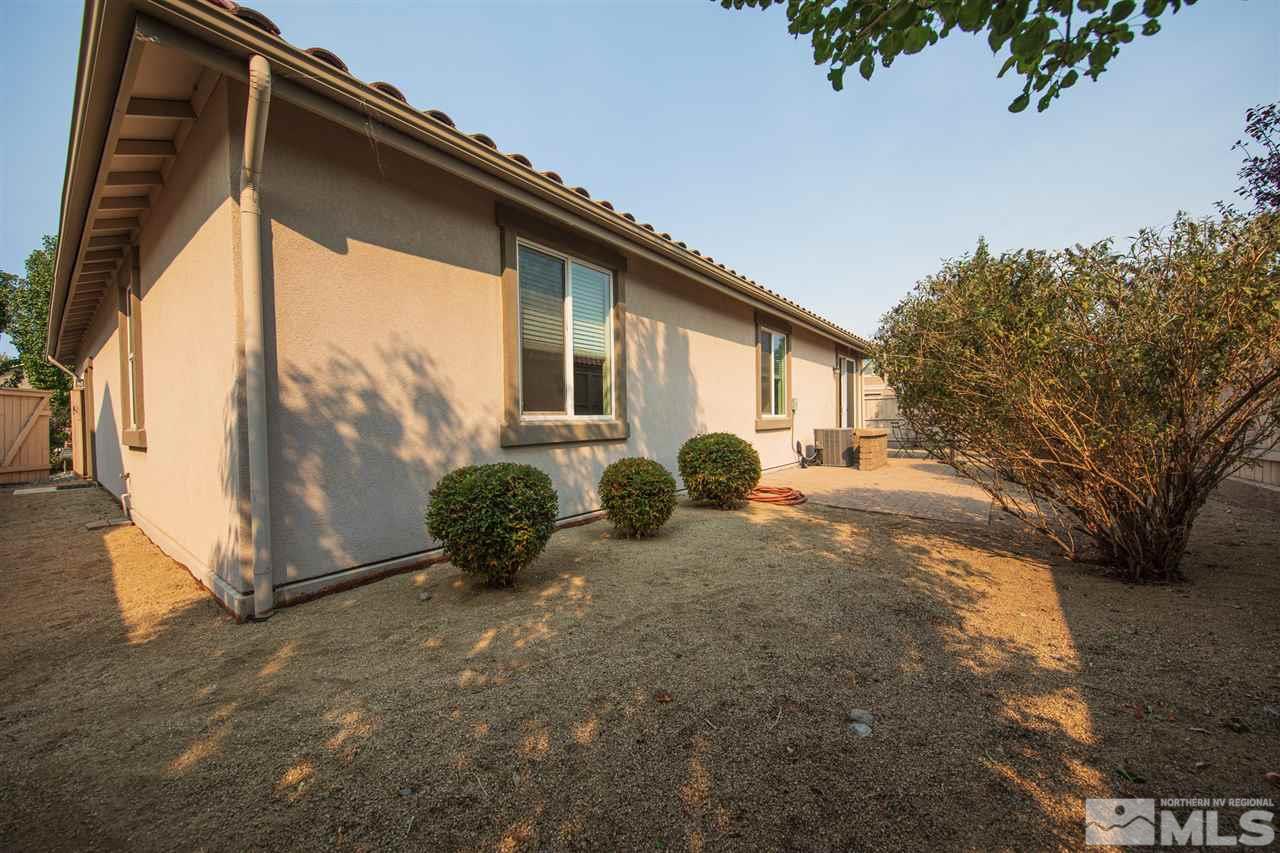 10800 Pebble Hill Drive Reno, NV 89521 - Photo 17 of 21 a view of backyard with large tree