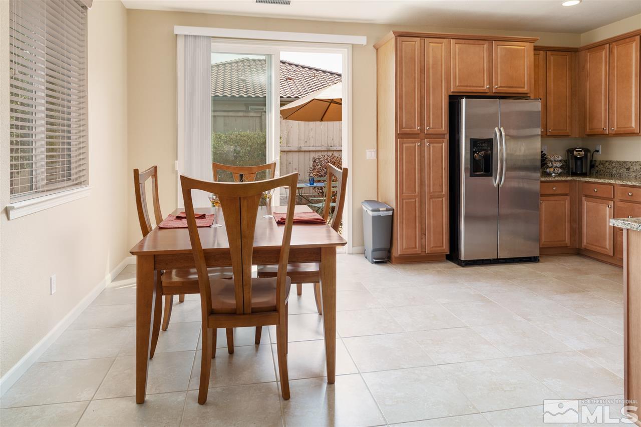 10800 Pebble Hill Drive Reno, NV 89521 - Photo 5 of 21 a view of a dining room with furniture and window