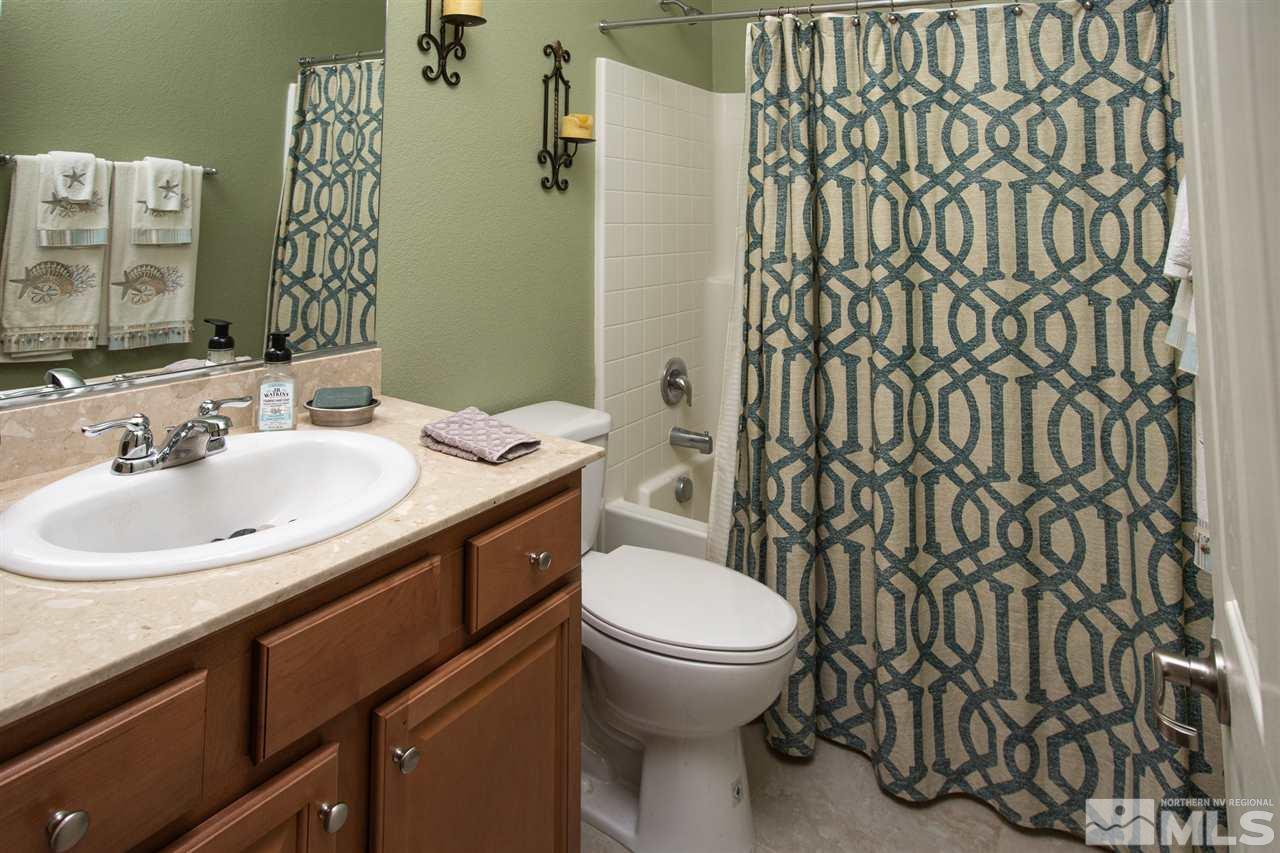 10800 Pebble Hill Drive Reno, NV 89521 - Photo 7 of 21 a bathroom with a sink toilet and a mirror