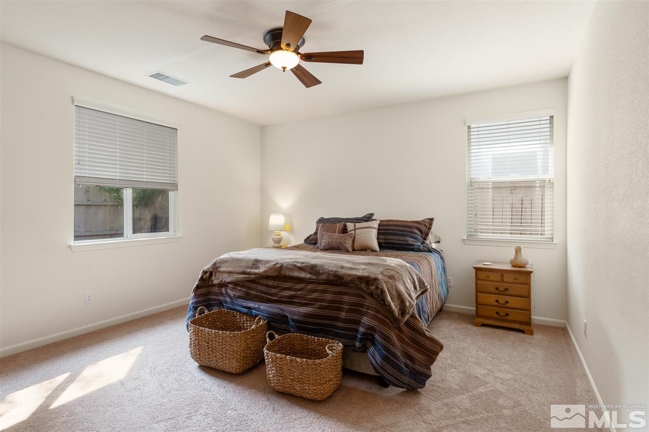 10800 Pebble Hill Drive Reno, NV 89521 - Photo 8 of 21 a bedroom with a bed and a window