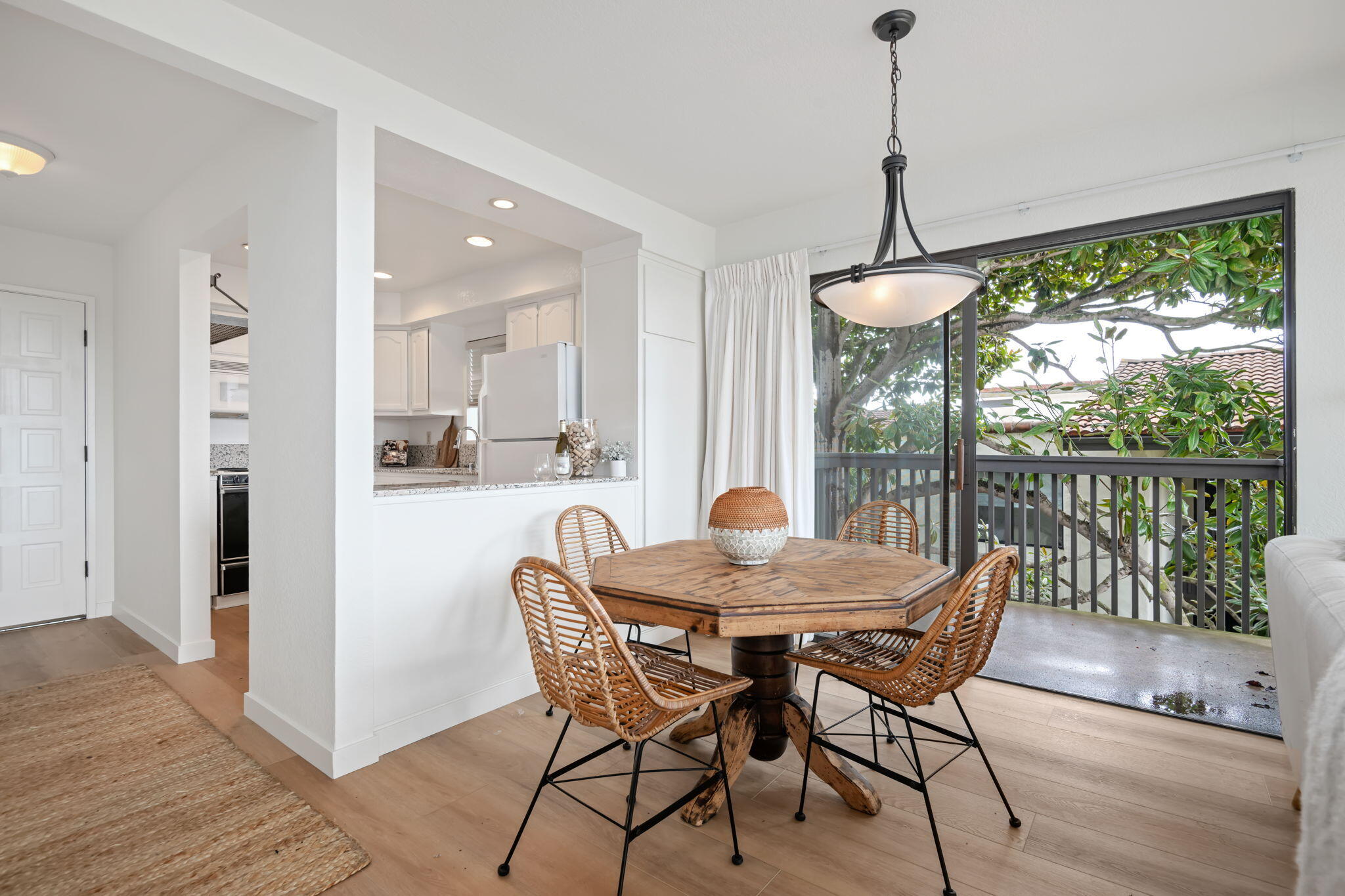 3375 Foothill Road, Unit 231 Carpinteria, CA 93013 - Photo 9 of 28 a view of a dining room with furniture window and wooden floor