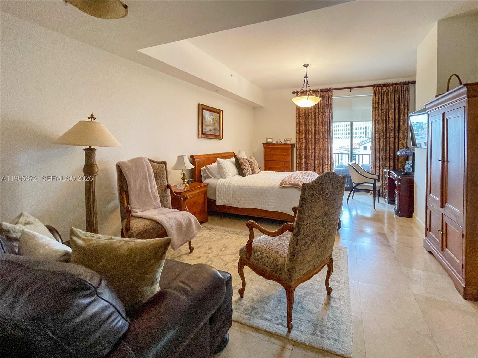 55 Merrick Way, Unit 812 Coral Gables, FL 33134 - Photo 21 of 28 Primary Bedroom with sitting area