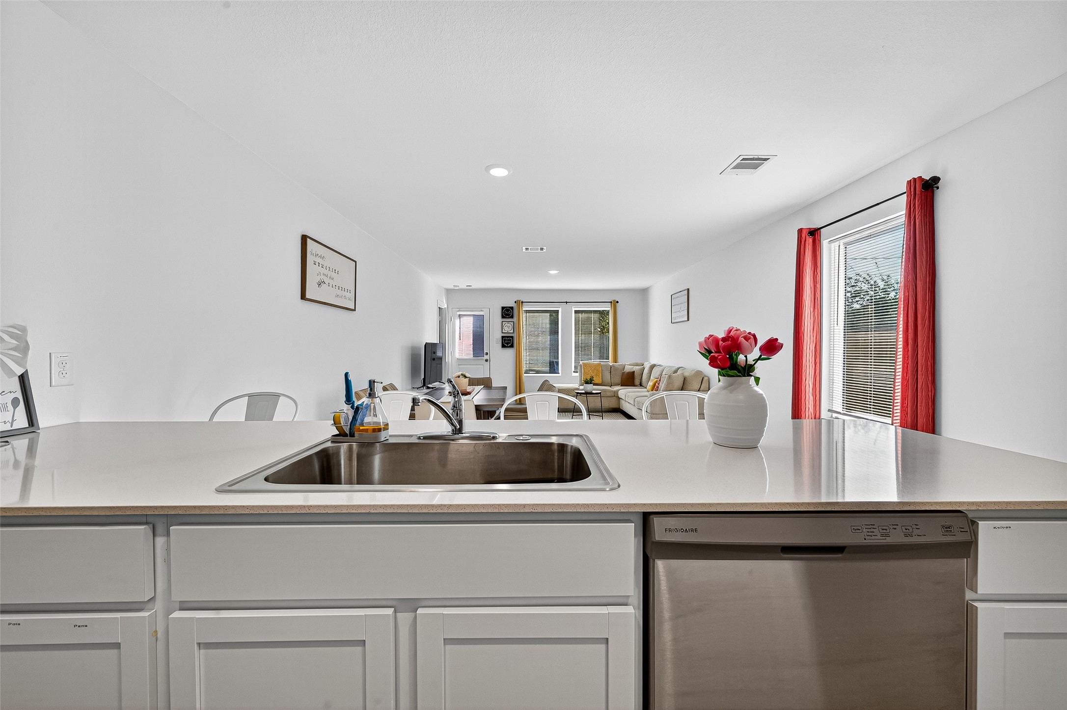 228 Laura Leigh Lane Angleton, TX 77515 - Photo 13 of 37 a kitchen with sink and natural light