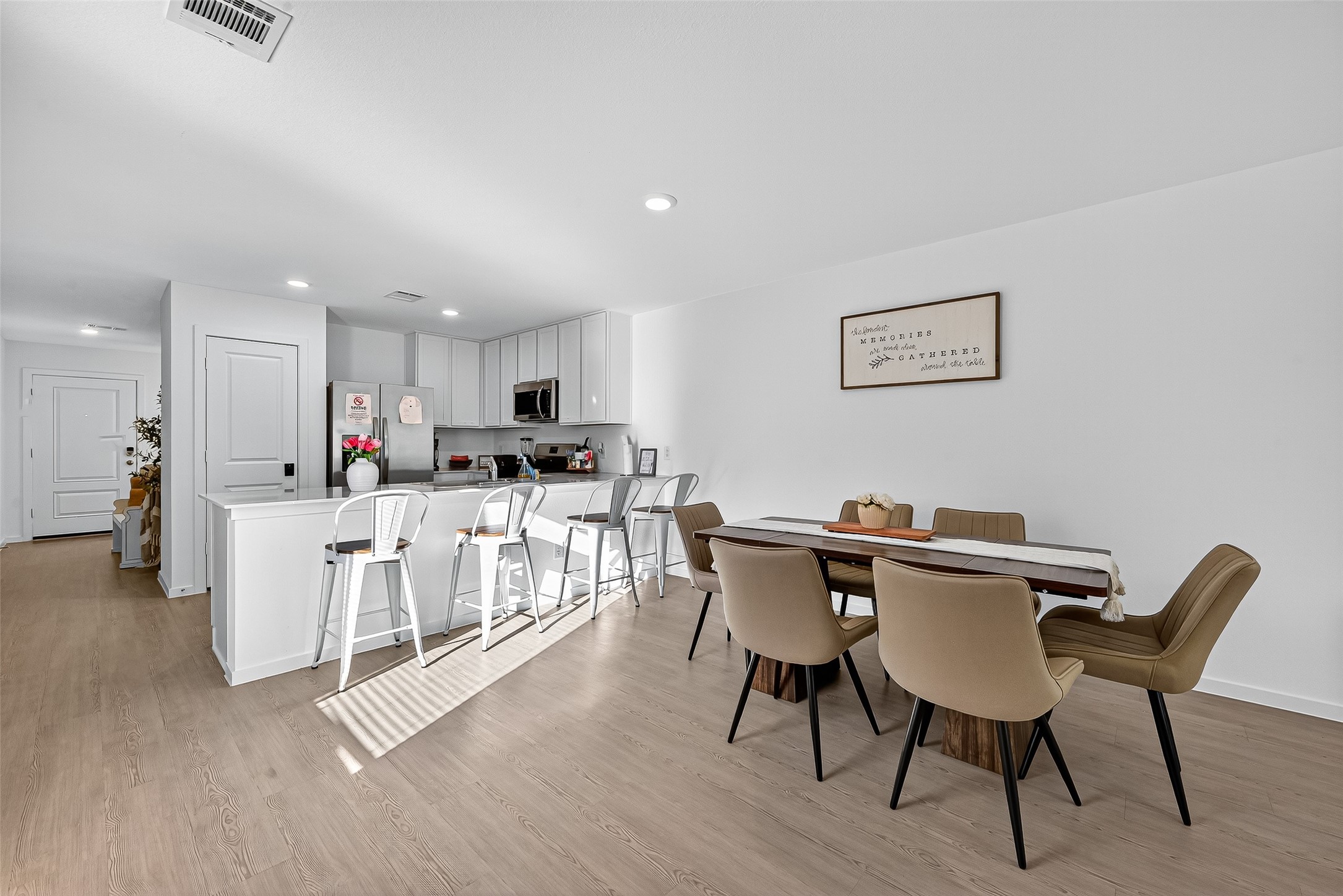 228 Laura Leigh Lane Angleton, TX 77515 - Photo 16 of 37 a view of a dining room with furniture and chandelier