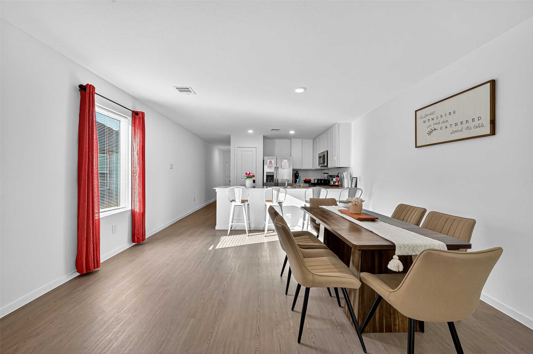 228 Laura Leigh Lane Angleton, TX 77515 - Photo 18 of 37 a view of a dining room with furniture and wooden floor