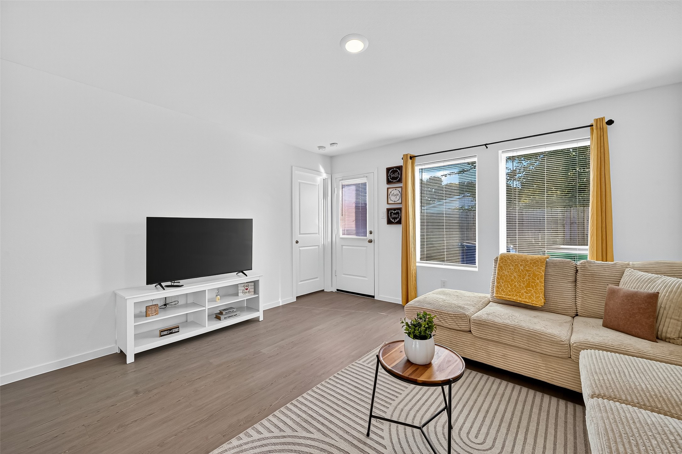 228 Laura Leigh Lane Angleton, TX 77515 - Photo 19 of 37 a living room with furniture and a flat screen tv