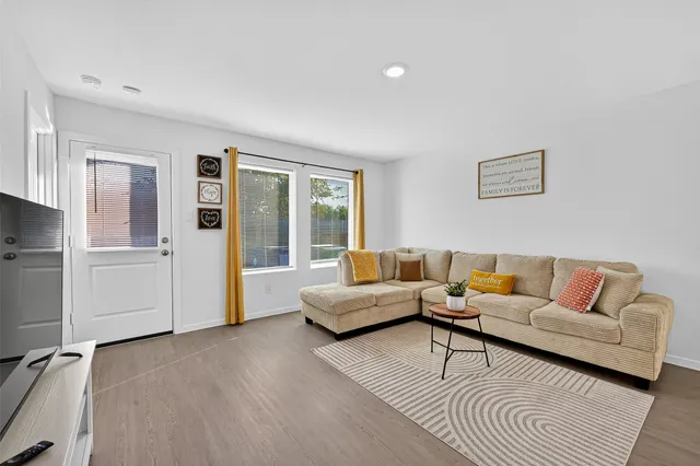 a view of living room with furniture and flower pot