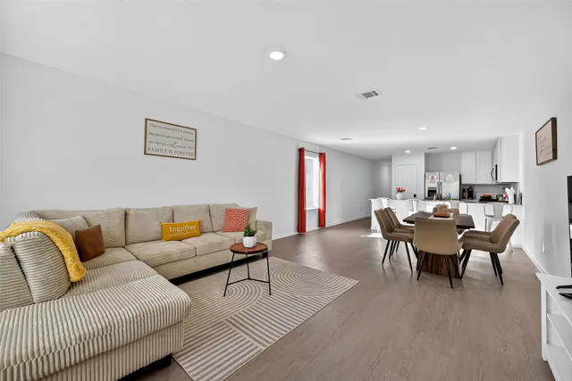 a bathroom with a sink a toilet and shower curtain