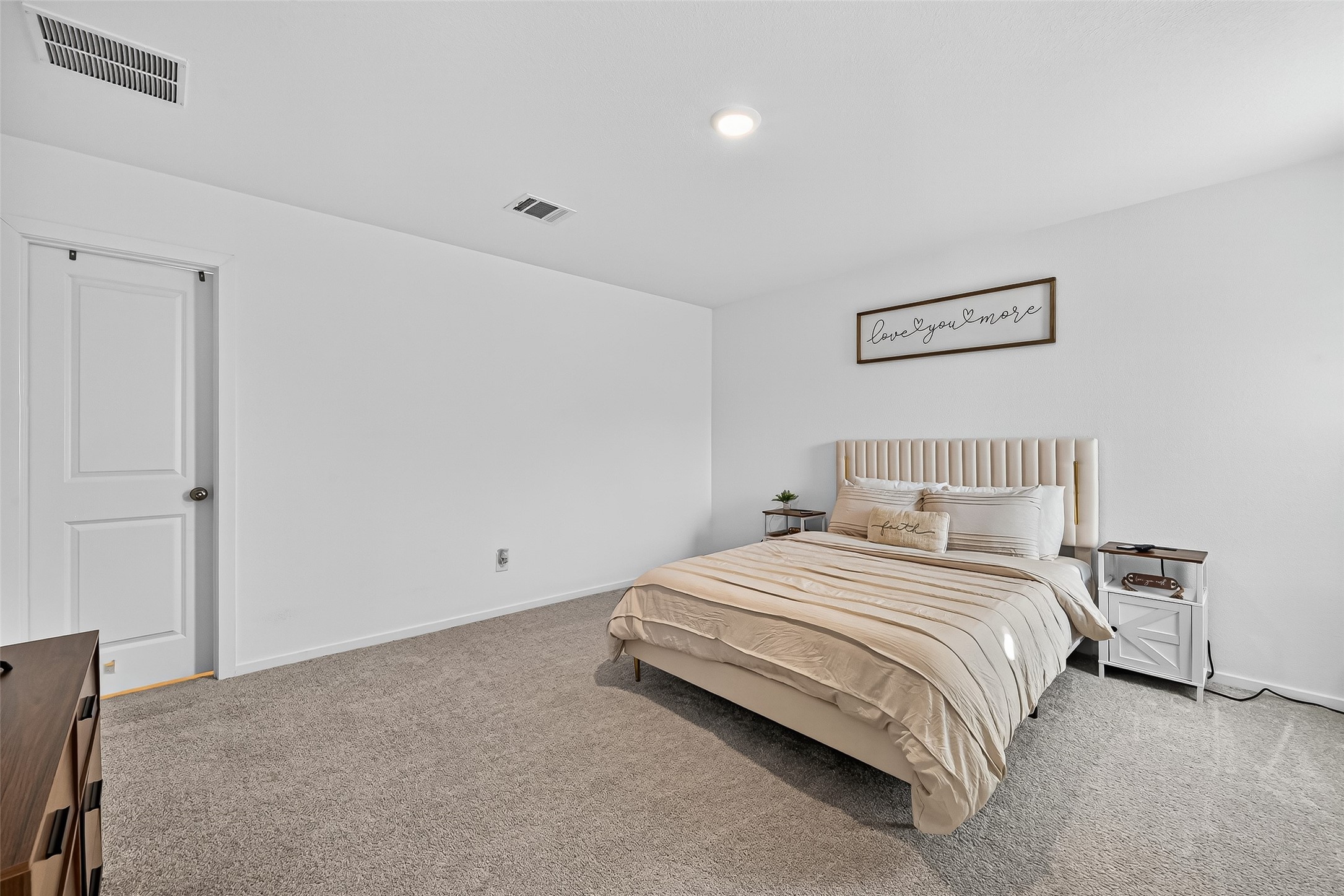 228 Laura Leigh Lane Angleton, TX 77515 - Photo 29 of 37 a bedroom with a bed and a night stand