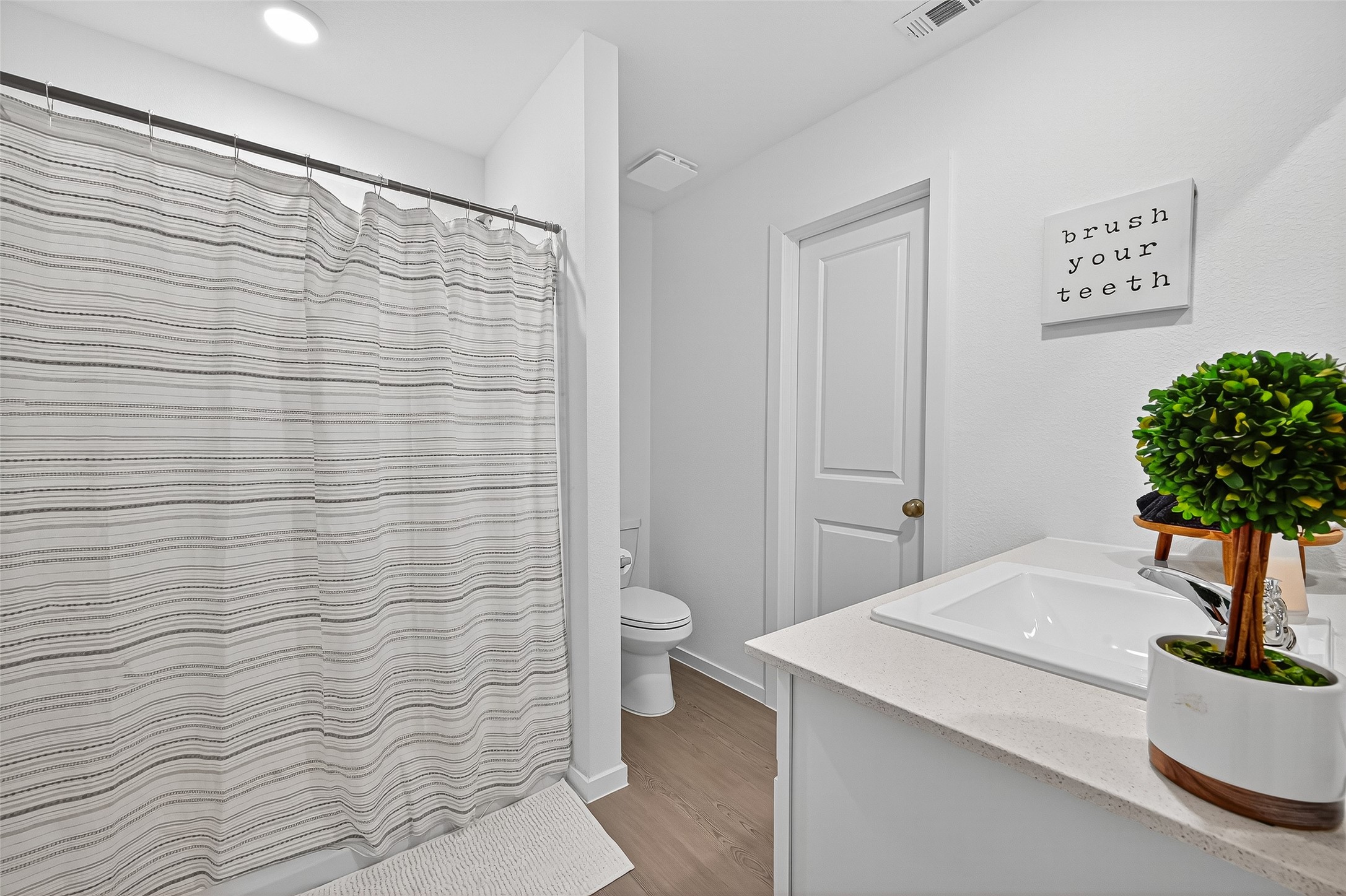 228 Laura Leigh Lane Angleton, TX 77515 - Photo 31 of 37 a bathroom with a sink a toilet and shower