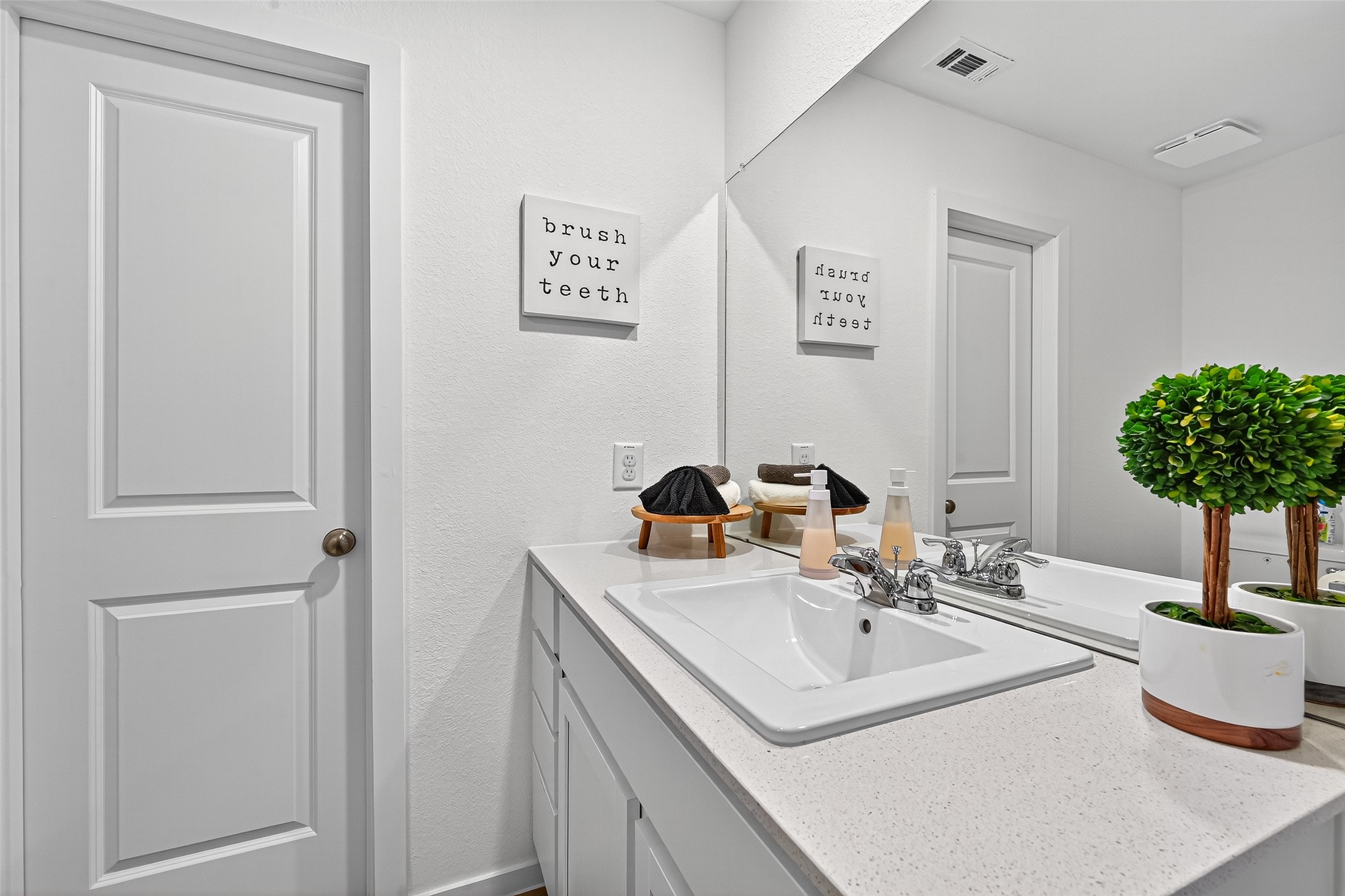 228 Laura Leigh Lane Angleton, TX 77515 - Photo 32 of 37 a bathroom with a sink and a mirror