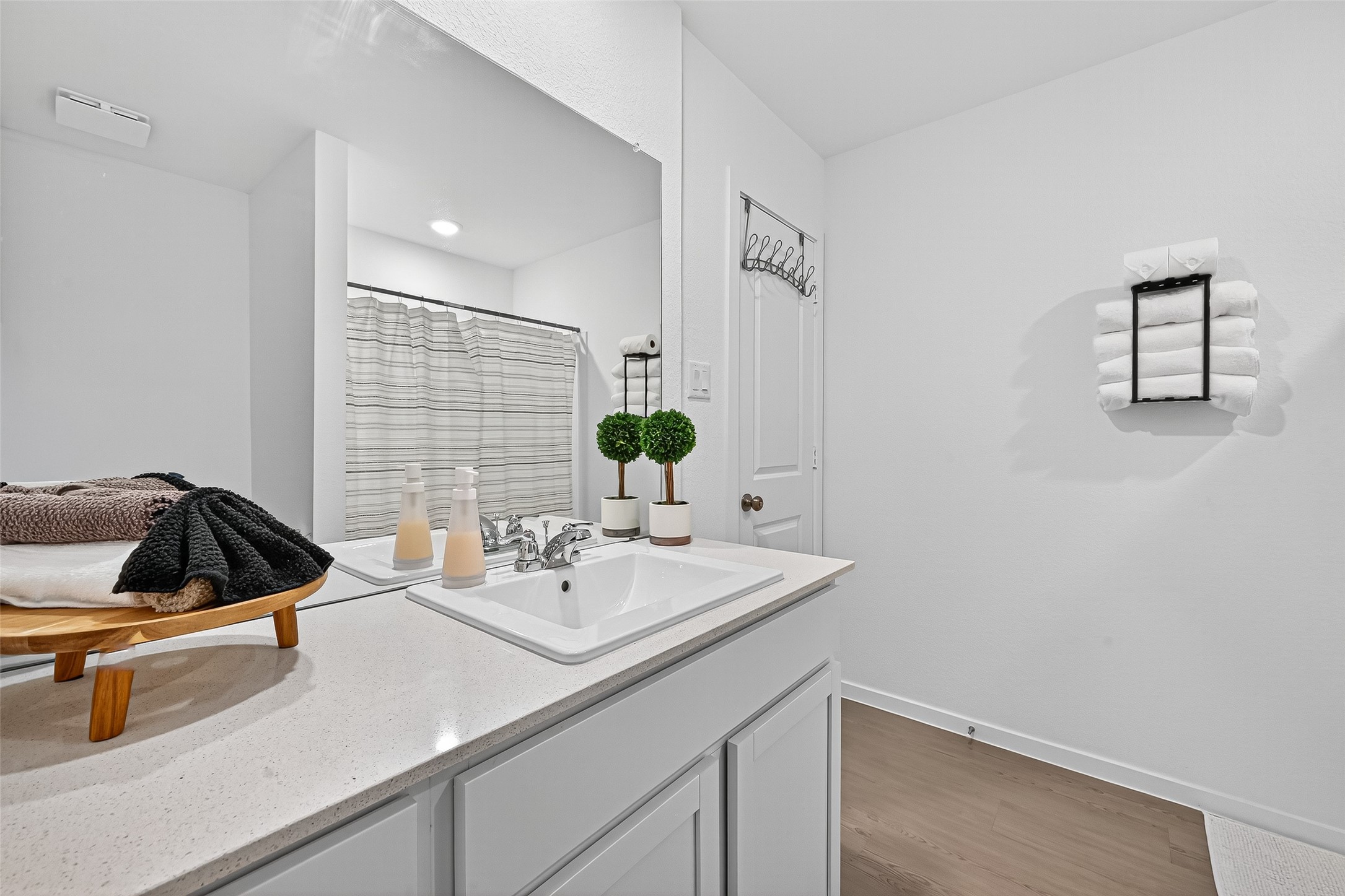 228 Laura Leigh Lane Angleton, TX 77515 - Photo 33 of 37 a bathroom with a sink and a mirror