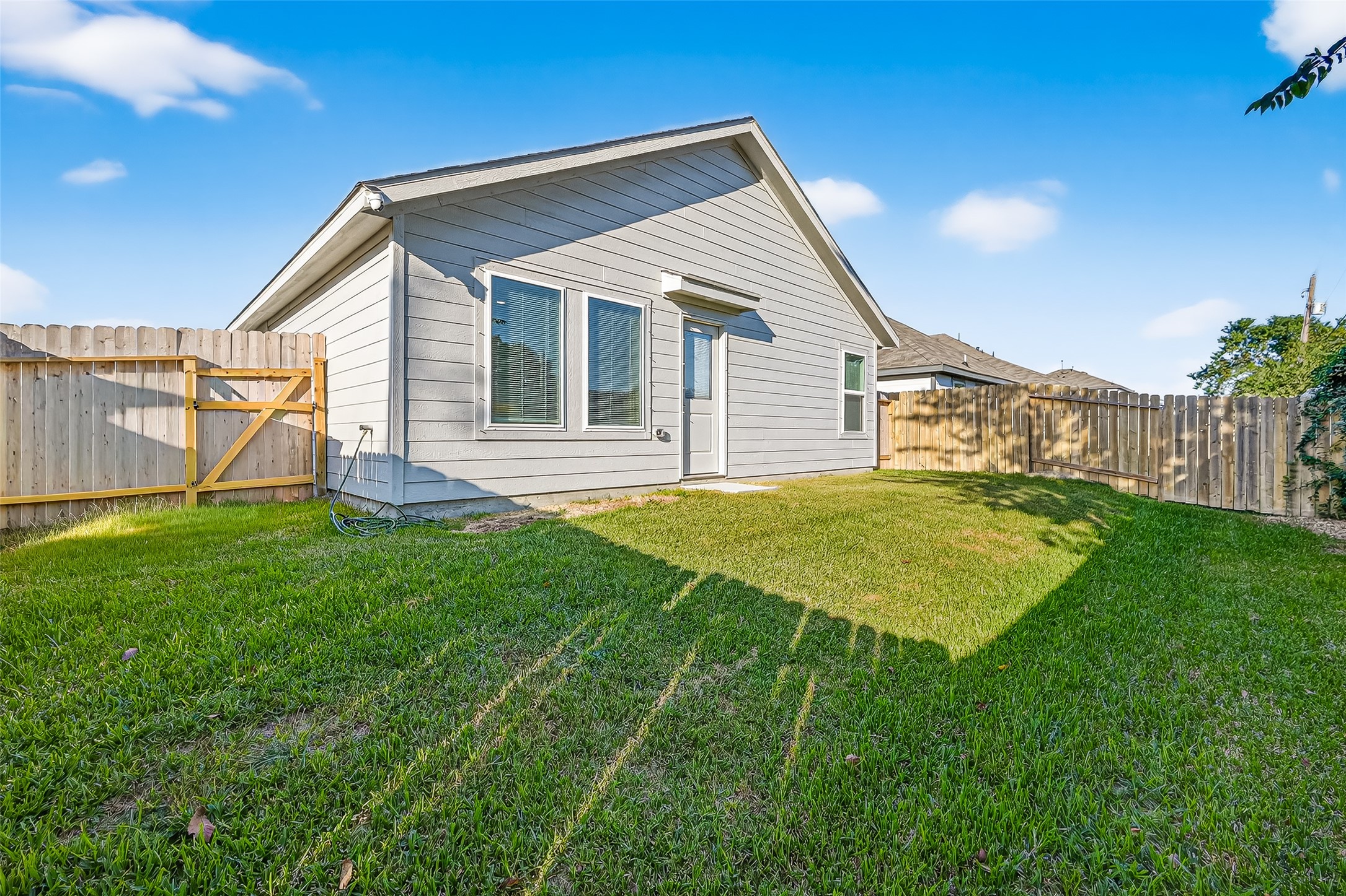 228 Laura Leigh Lane Angleton, TX 77515 - Photo 35 of 37 a view of a house with a backyard