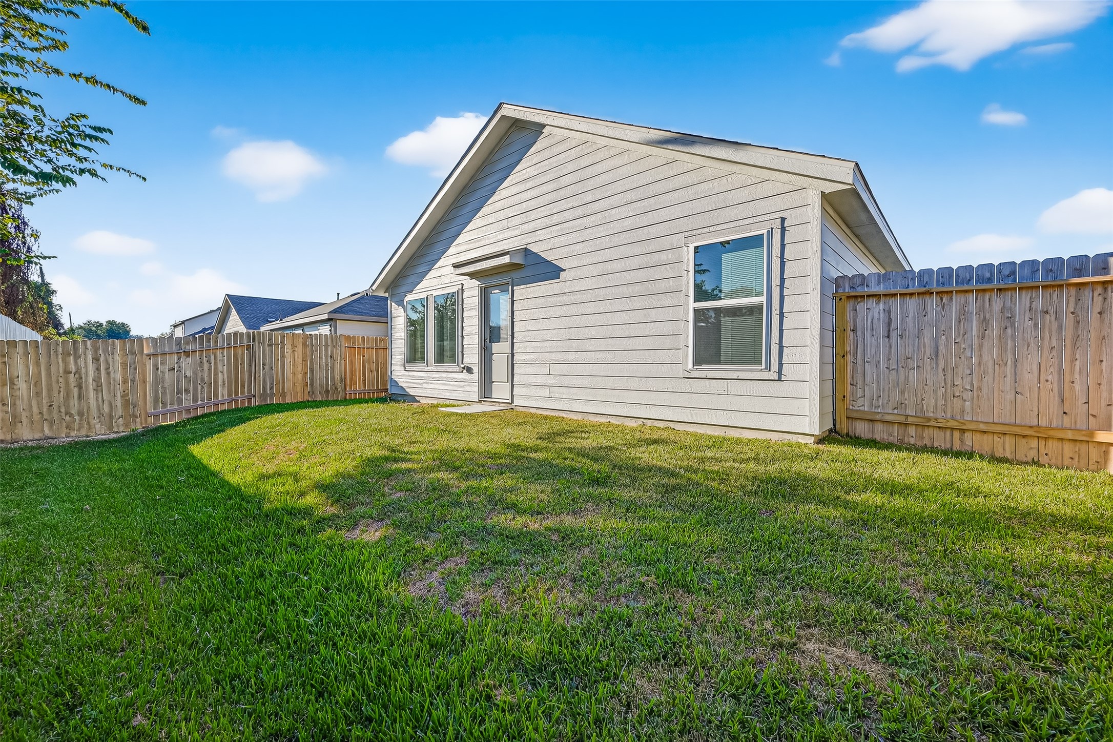228 Laura Leigh Lane Angleton, TX 77515 - Photo 36 of 37 a front view of a house with yard and wooden fence