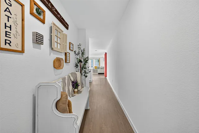 a kitchen with a microwave and flowers