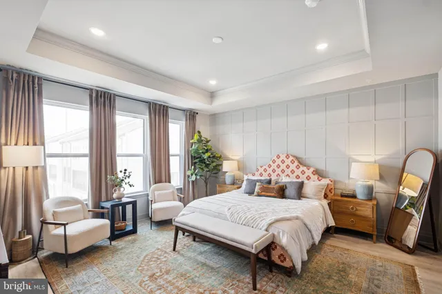 a bedroom with a large bed and a couch