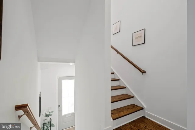 a view of entryway with wooden floor