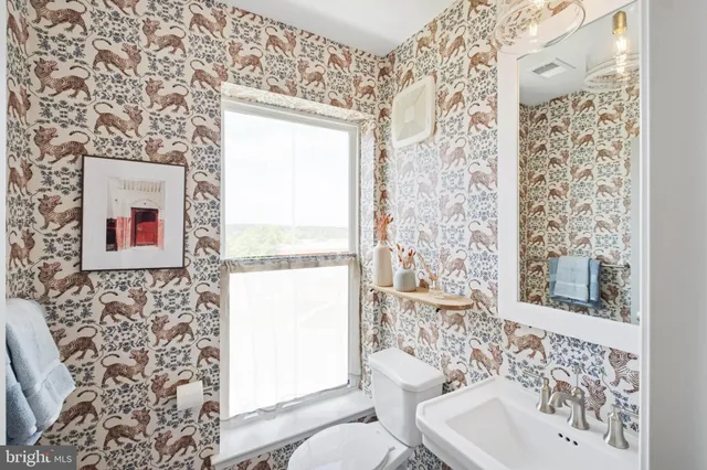 a bathroom with a toilet and a sink