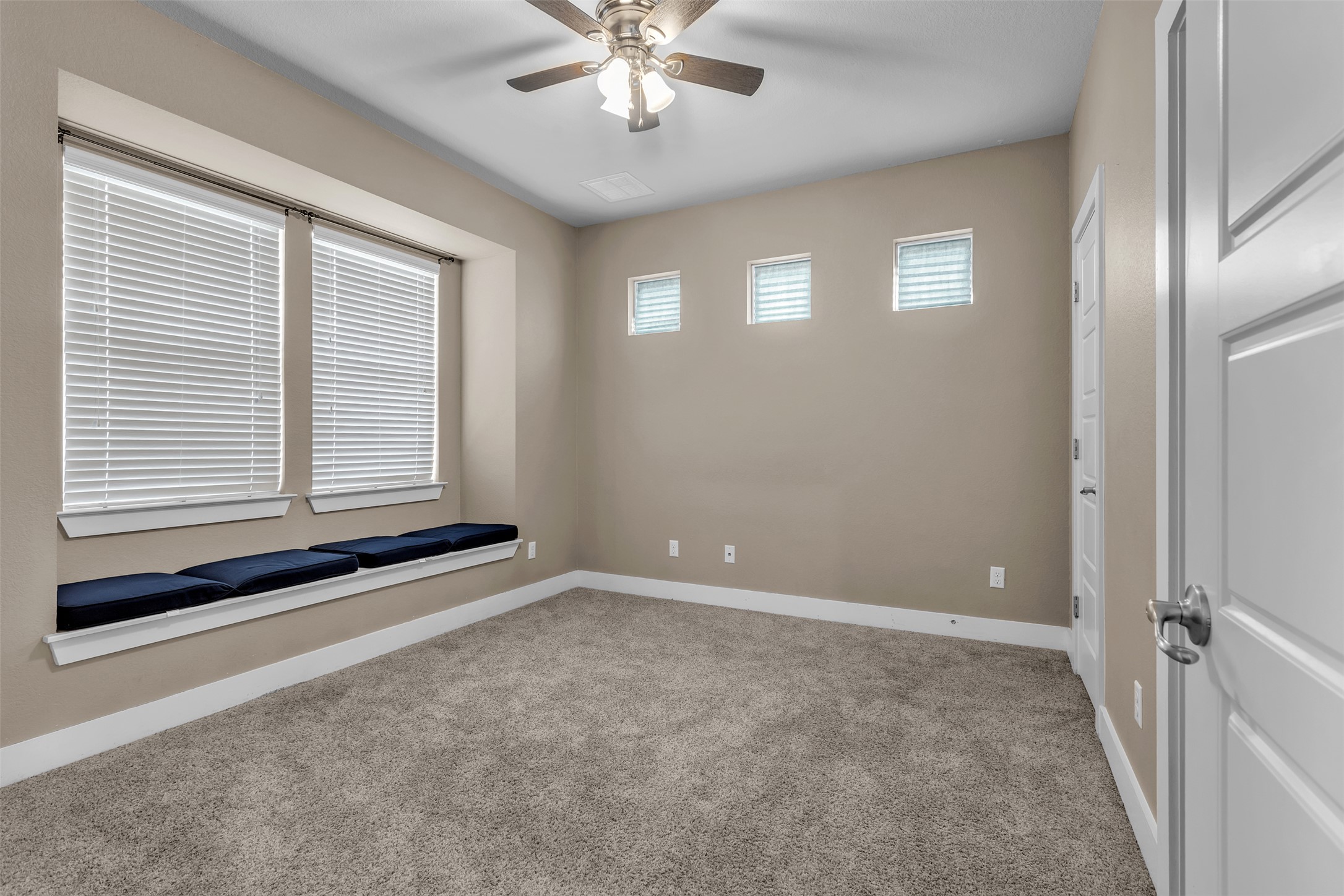 12212 Tawny Farms Road, Unit 142 Austin, TX 78748 - Photo 3 of 21 A window seat offers a tranquil nook in this well-lit room, complemented by a convenient ceiling fan.