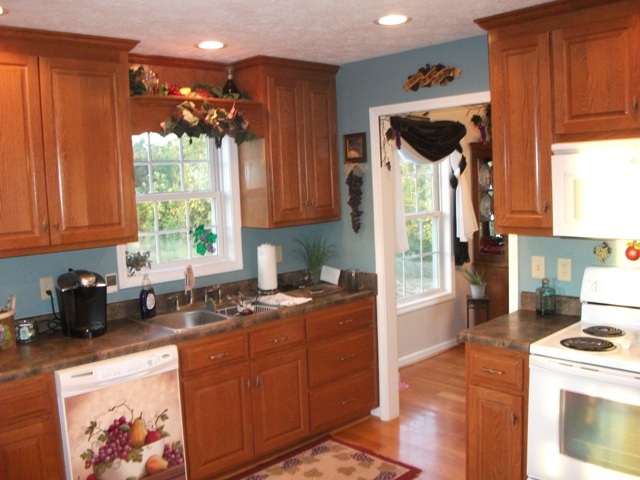 4012 Hatchett Road Penhook, VA 24137 - Photo 3 of 29 a kitchen with stainless steel appliances granite countertop a sink a stove a refrigerator and cabinets