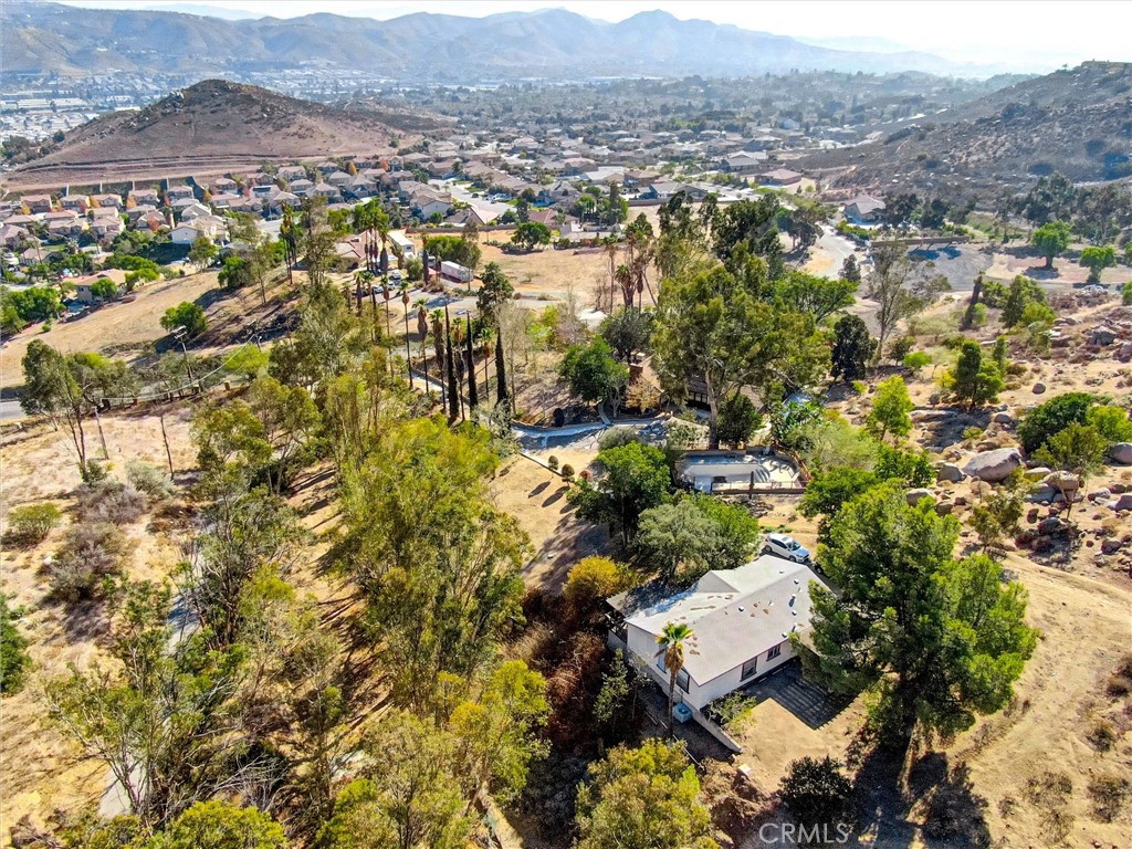 an aerial view of residential house and green space