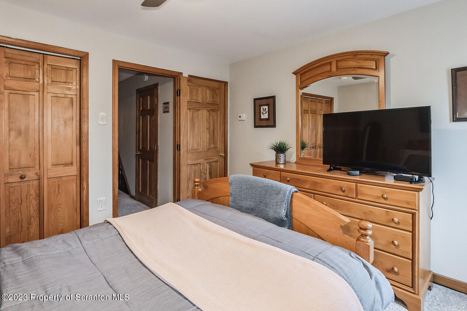 715 Landis Street Scranton, PA 18504 - Photo 11 of 15 a bedroom with a bed and a flat screen tv