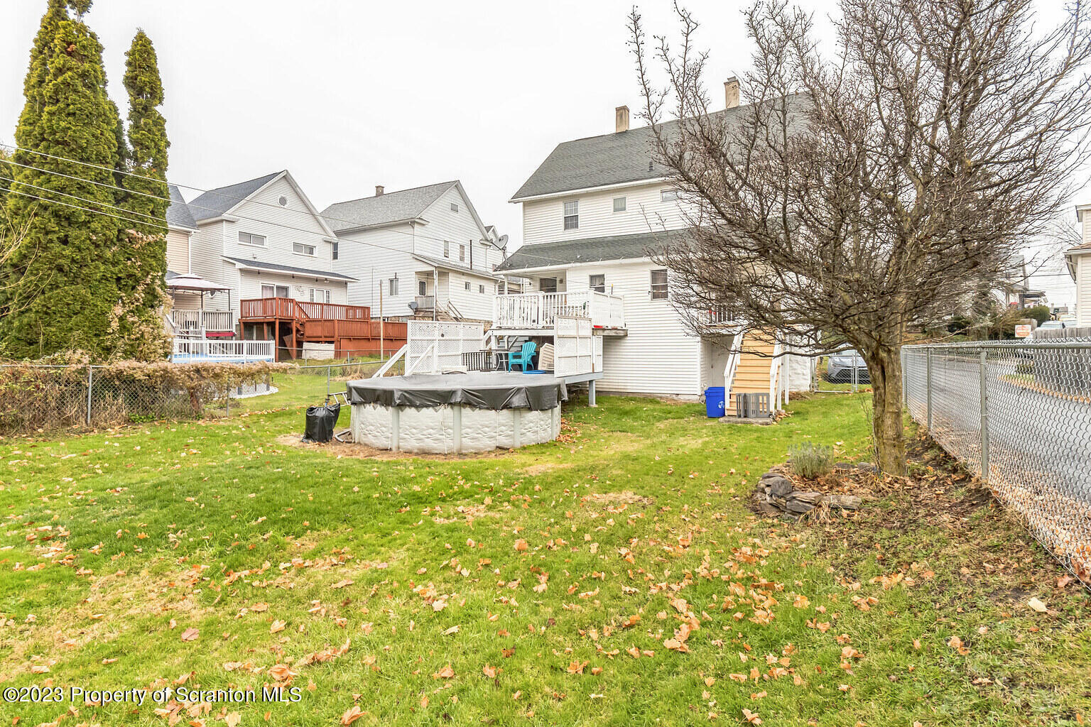 715 Landis Street Scranton, PA 18504 - Photo 2 of 15 a front view of a house with a yard table and chairs