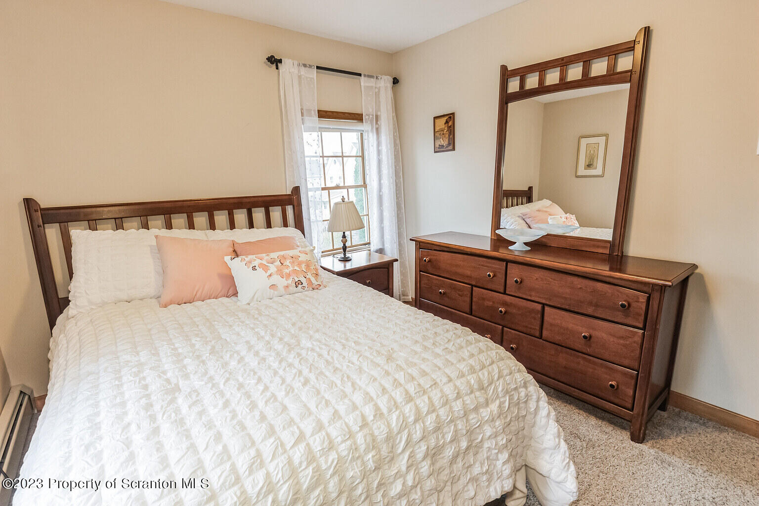 715 Landis Street Scranton, PA 18504 - Photo 8 of 15 a bedroom with a bed and a dresser