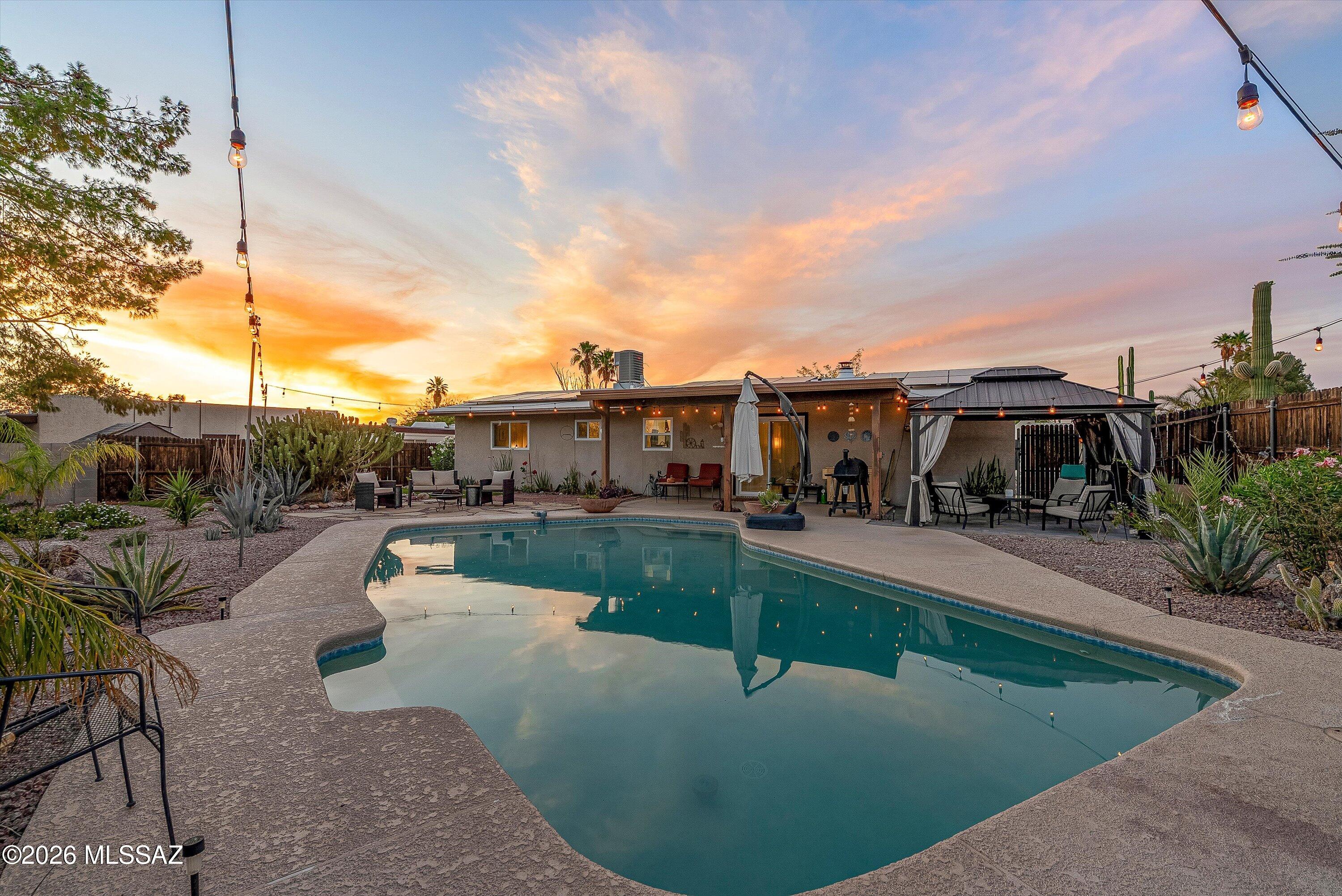 3949 West Mars Street Tucson, AZ 85741 - Photo 10 of 27 a swimming pool with outdoor seating