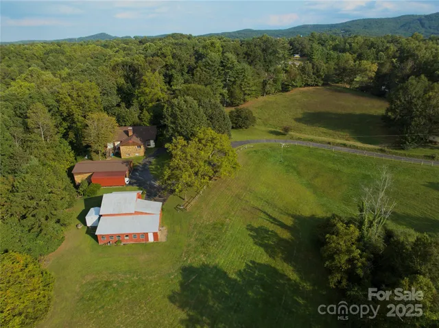 a aerial view of a house with a yard