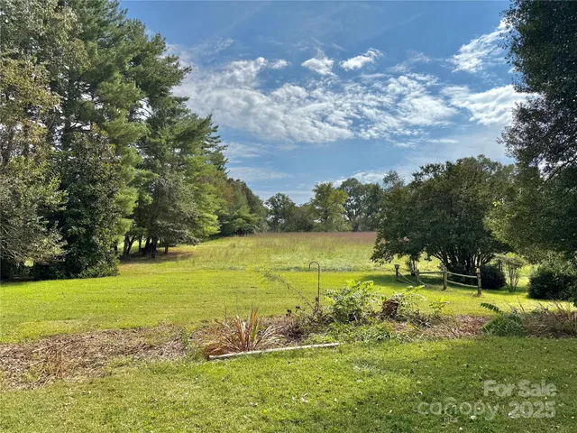 a view of a lake with a big yard