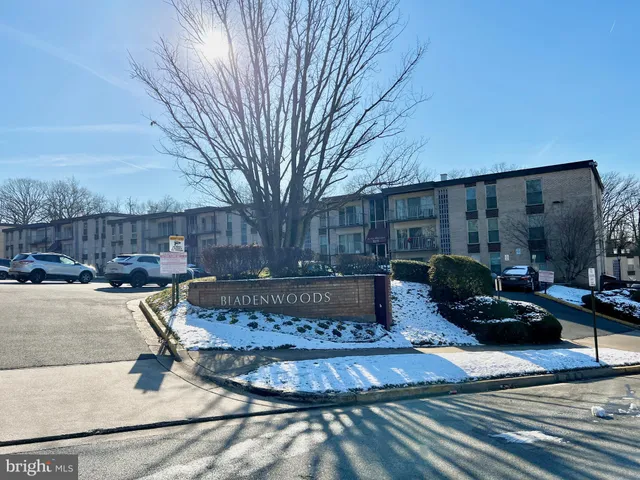 a view of a chairs and tables in the back yard of the house