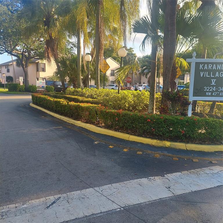 3420 Northwest 47th Avenue, Unit 3143 Pompano Beach, FL 33063 - Photo 2 of 14 a view of yard