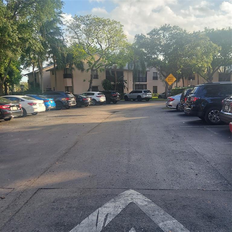 3420 Northwest 47th Avenue, Unit 3143 Pompano Beach, FL 33063 - Photo 4 of 14 a view of a city street from a building