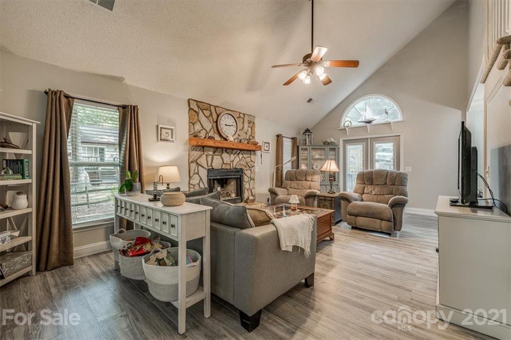 2129 Manawa Lane Tega Cay, SC 29708 - Photo 20 of 42 a living room with fireplace furniture and a large window