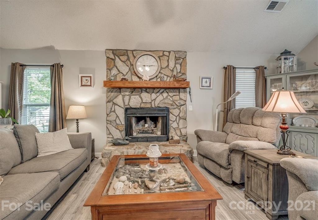 2129 Manawa Lane Tega Cay, SC 29708 - Photo 21 of 42 a living room with furniture and a fireplace