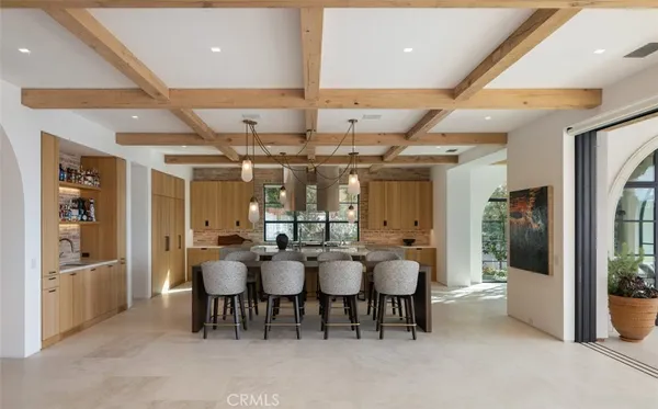 an open kitchen with dining table and chairs