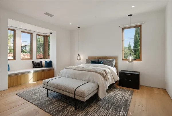 a bedroom with a bed and a couch