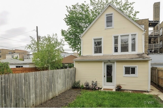 4205 North Bernard Street, Unit R Chicago, IL 60618 - Photo 1 of 12 a view of a house with a yard