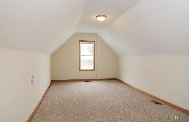 4205 North Bernard Street, Unit R Chicago, IL 60618 - Photo 11 of 12 an empty room with windows