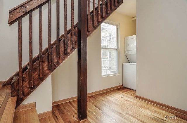 4205 North Bernard Street, Unit R Chicago, IL 60618 - Photo 6 of 12 a view of an entryway with wooden floor and door