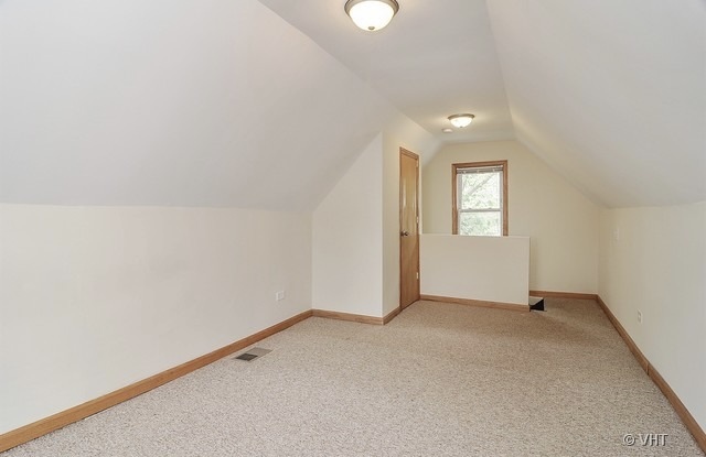 4205 North Bernard Street, Unit R Chicago, IL 60618 - Photo 10 of 12 an empty room with windows