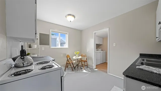a kitchen with stainless steel appliances a white cabinets stove and refrigerator