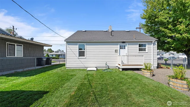 a house view with a backyard space