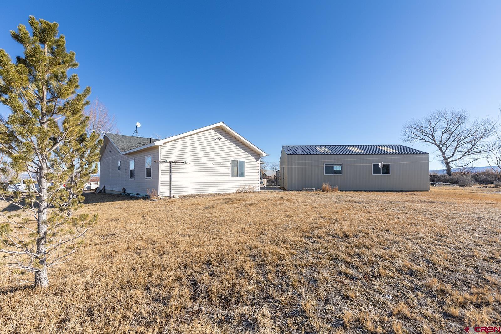 17824 B Road Delta, CO 81416 - Photo 24 of 33 a view of a house with a yard