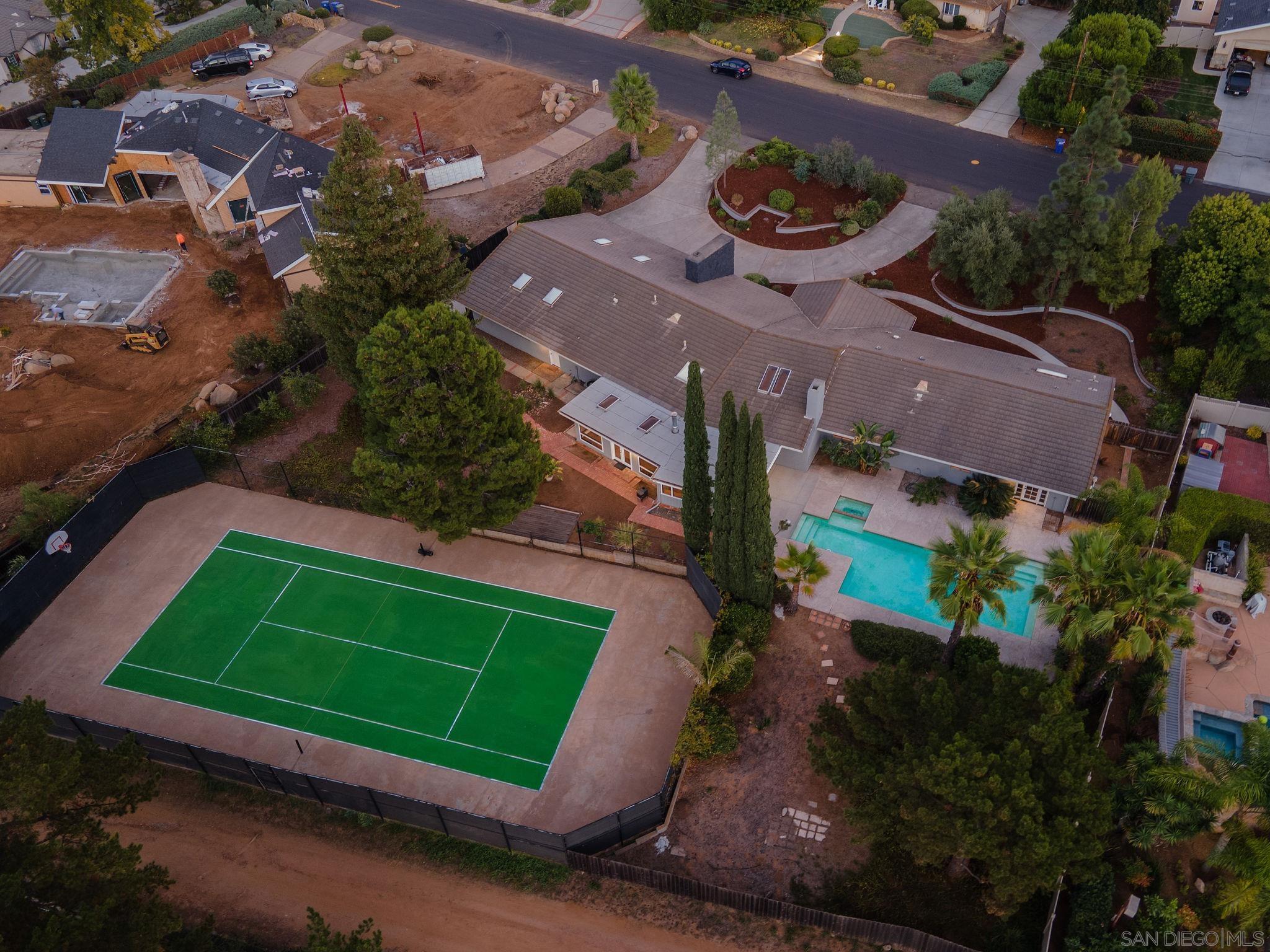 an aerial view of a backyard and a house